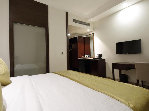 Regenta Inn Ranip Ahmedabad : photo 5 de la chambre chambre double ou lits jumeaux deluxe 