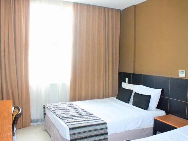 Hotel Atlântico Tower : photo 1 de la chambre chambre triple de luxe