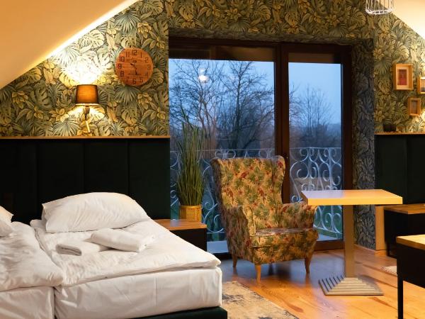 Domek u Kowala : photo 1 de la chambre chambre quadruple avec balcon