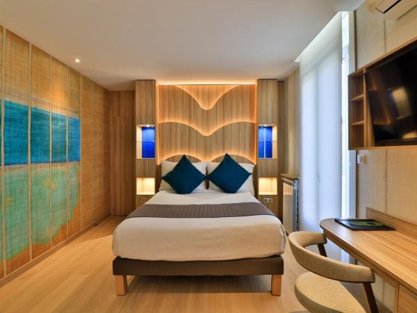 Hôtel Provençal : photo 4 de la chambre chambre deluxe avec 2 lits queen-size