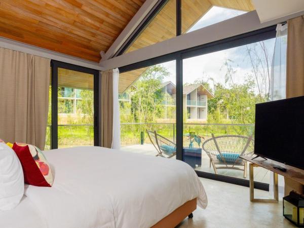 Island Escape Burasari : photo 2 de la chambre villa 1 chambre avec balcon - vue sur lagon - transfert régulier en bateau