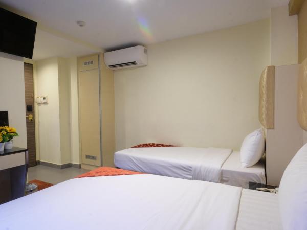 Sandpiper Hotel Singapore : photo 1 de la chambre chambre familiale de luxe avec fenêtre