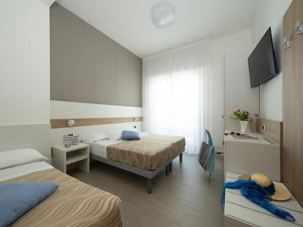 Hotel Pillon : photo 4 de la chambre chambre triple deluxe