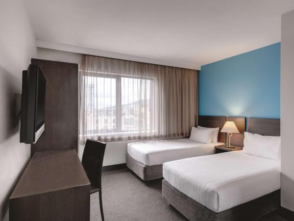 Travelodge Hotel Hobart : photo 2 de la chambre petite chambre lits jumeaux