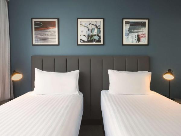 Travelodge Hotel Hobart : photo 1 de la chambre petite chambre lits jumeaux