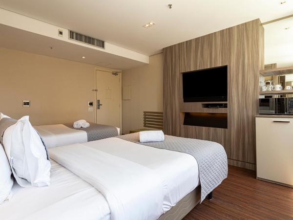 You Stay at Vila Olimpia - ITC : photo 5 de la chambre chambre lit king-size deluxe
