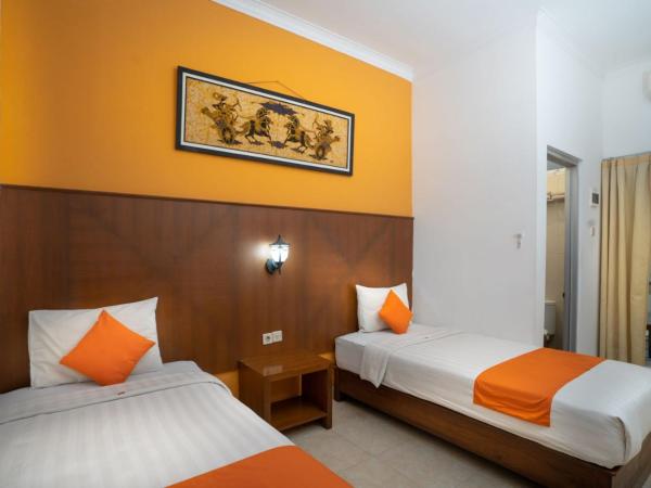 Hotel Poncowinatan - Tugu : photo 1 de la chambre chambre lits jumeaux Économique