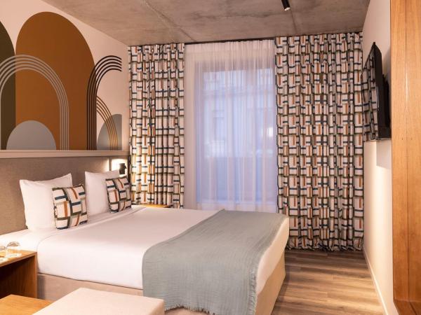 La Belle Ville : photo 2 de la chambre chambre deluxe