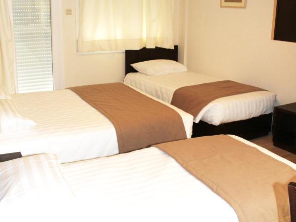 Rea Hotel : photo 4 de la chambre chambre quadruple Économique