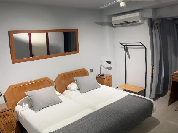 Hostal Arenal : photo 1 de la chambre chambre lits jumeaux