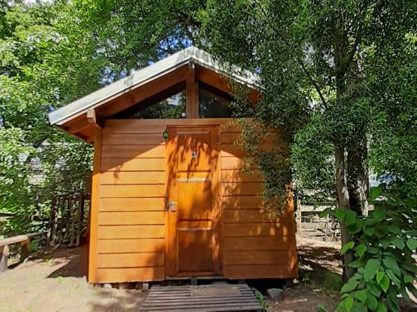 Hostel Los Coihues : photo 2 de la chambre chambre quadruple - vue sur jardin