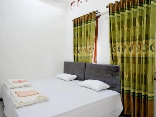 Griya Mataram Kotagede Mitra RedDoorz : photo 3 de la chambre chambre lits jumeaux standard