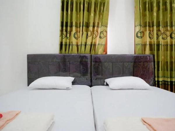 Griya Mataram Kotagede Mitra RedDoorz : photo 4 de la chambre chambre lits jumeaux standard