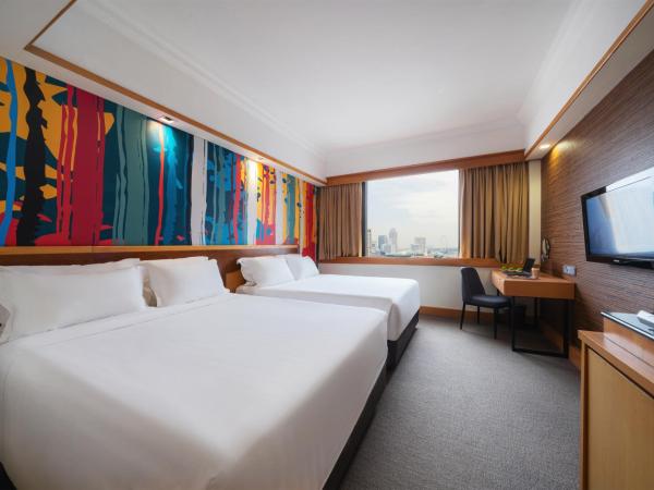 Furama City Centre : photo 1 de la chambre chambre familiale