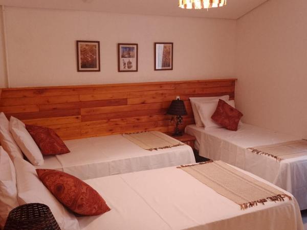 Pousada Caminhos de Minas Belo Horizonte : photo 2 de la chambre chambre triple confort