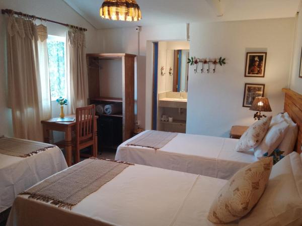 Pousada Caminhos de Minas Belo Horizonte : photo 2 de la chambre chambre triple confort