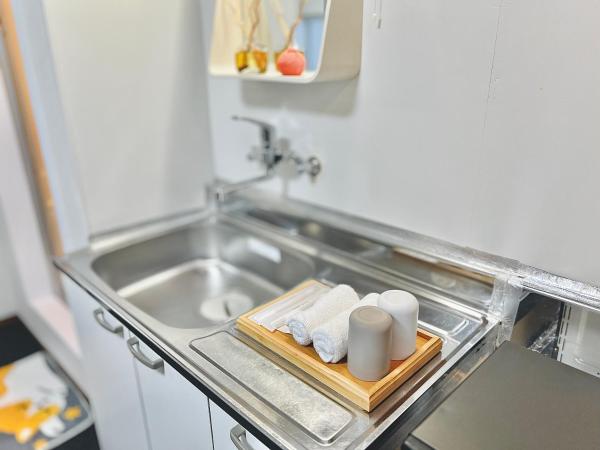 attomi hostel : photo 3 de la chambre chambre quadruple avec salle de bains