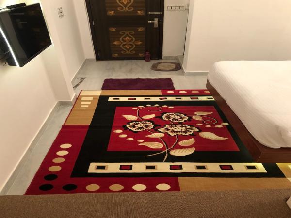 Hotel Nirvana Lakeside : photo 2 de la chambre chambre double deluxe (2 adultes + 1 enfant)