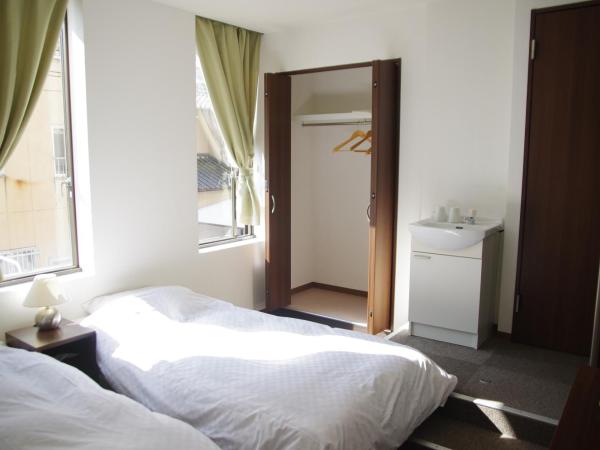 Suminoyu Hotel : photo 3 de la chambre chambre lits jumeaux avec salle de bains commune