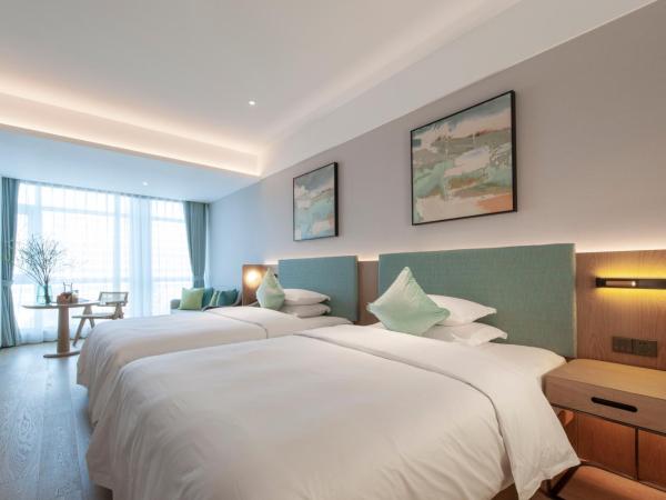 SSAW Boutique Hotel Zhijiang : photo 1 de la chambre chambre lits jumeaux deluxe