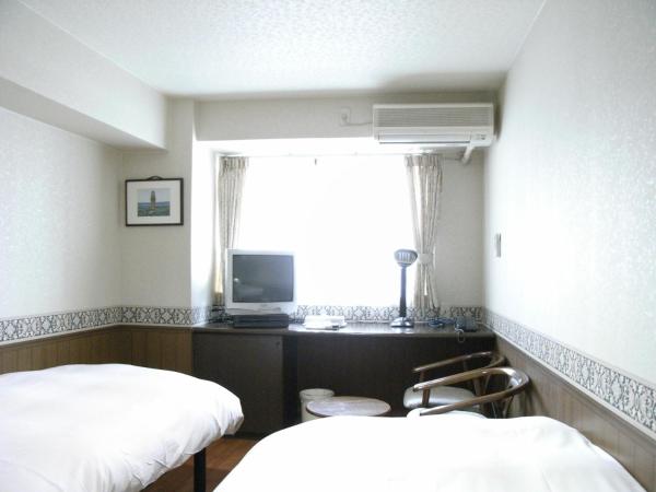 Sunplaza Rinkai : photo 1 de la chambre chambre lits jumeaux