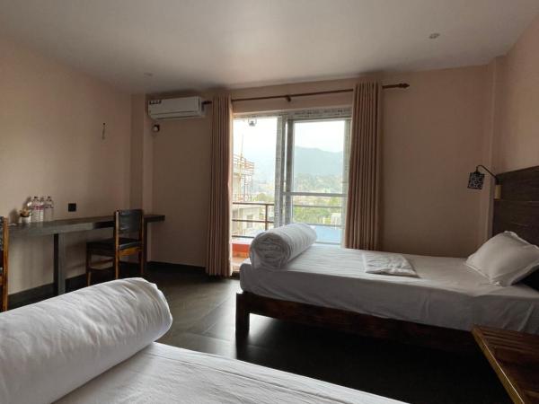 Hostel The Good Earth Pvt. Ltd. : photo 1 de la chambre chambre lits jumeaux - vue sur montagne