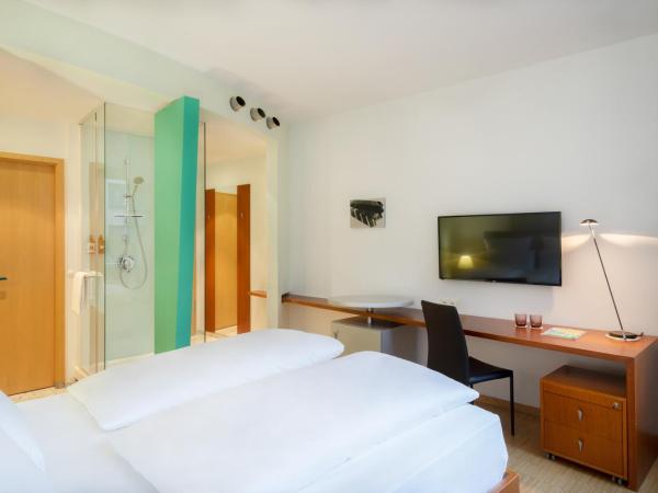 FOUR Munich Neue Messe : photo 1 de la chambre chambre lits jumeaux standard avec vue sur cour