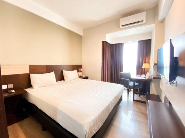 Hotel Gunawangsa MERR : photo 1 de la chambre chambre deluxe double ou lits jumeaux