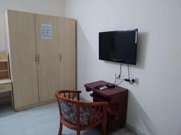 NirmalVilla Cherry : photo 10 de la chambre chambre double deluxe (2 adultes + 1 enfant)