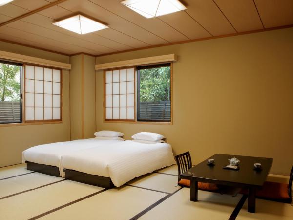 Gion Ryokan Karaku : photo 2 de la chambre grande chambre lits jumeaux avec sol tatami