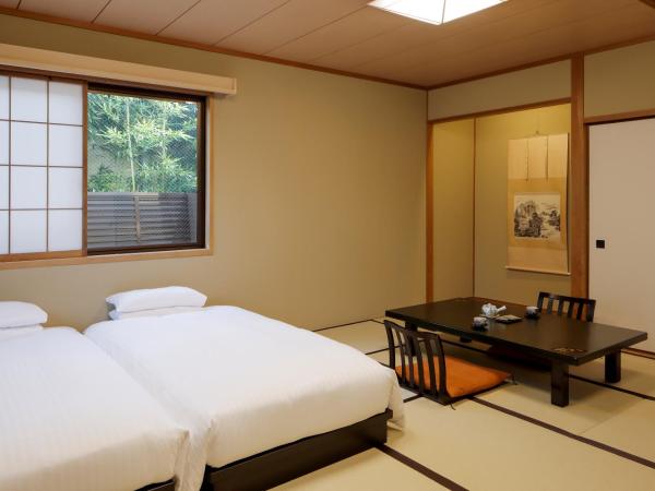 Gion Ryokan Karaku : photo 3 de la chambre grande chambre lits jumeaux avec sol tatami