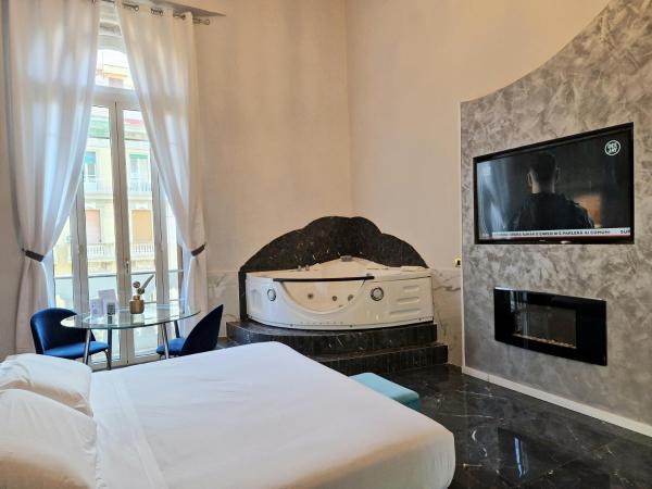 Comfort Zone Naples : photo 3 de la chambre suite lit queen-size avec baignoire spa