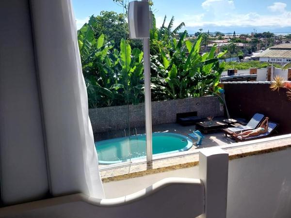 Namorada Brava Guest House : photo 5 de la chambre chambre quadruple - vue sur jardin