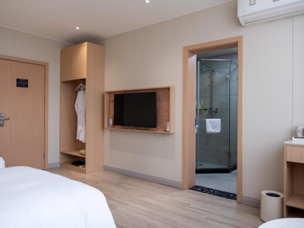 Shanghai JOYFUL YARD Hotel-Free shuttle bus from Pudong Airport and Disneylan : photo 6 de la chambre chambre lits jumeaux deluxe