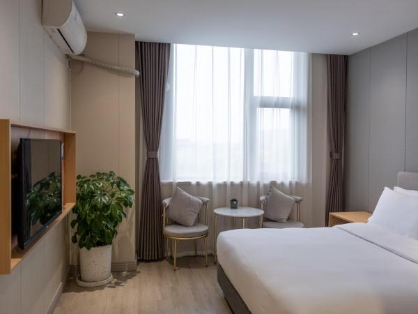 Shanghai JOYFUL YARD Hotel-Free shuttle bus from Pudong Airport and Disneylan : photo 7 de la chambre chambre standard lit queen-size