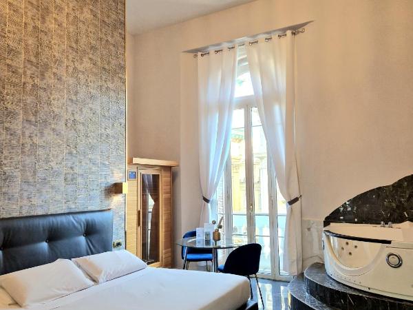 Comfort Zone Naples : photo 1 de la chambre suite lit queen-size avec baignoire spa