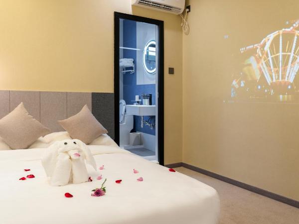Puzzle Hotel Guangzhou Fenghuang New Village Subway Station : photo 10 de la chambre chambre lit queen-size