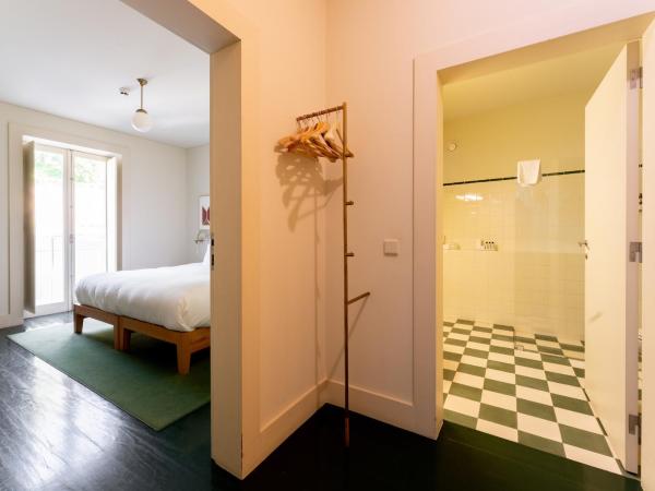 Duas Portas Townhouse : photo 2 de la chambre chambre double - vue sur jardin