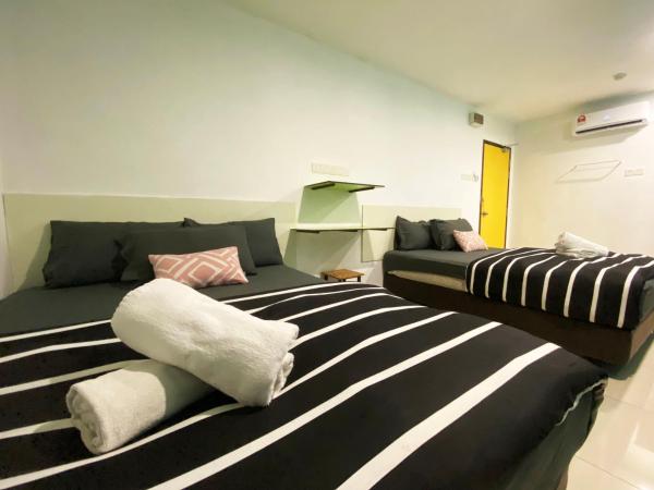 Hotel 91 Taman Daya : photo 2 de la chambre chambre double familiale