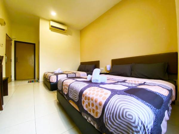 Ze Xiang Hotel - Desa Jaya Ikea Self Check in : photo 3 de la chambre chambre familiale