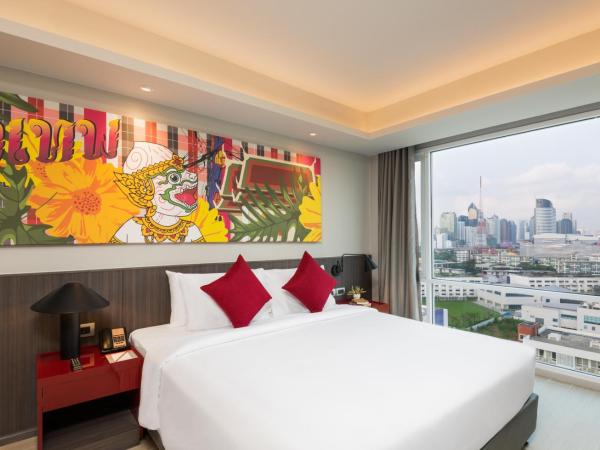 Maitria Hotel Rama 9 Bangkok - A Chatrium Collection : photo 2 de la chambre chambre lit king-size premier - vue sur jardin