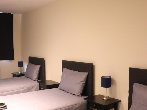 Dockside Lodge : photo 1 de la chambre chambre triple standard