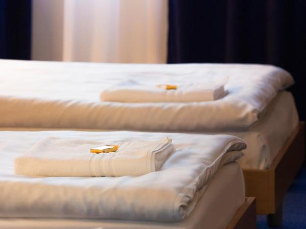 Dom Turystyczny Indigo : photo 5 de la chambre chambre triple avec salle de bains privative