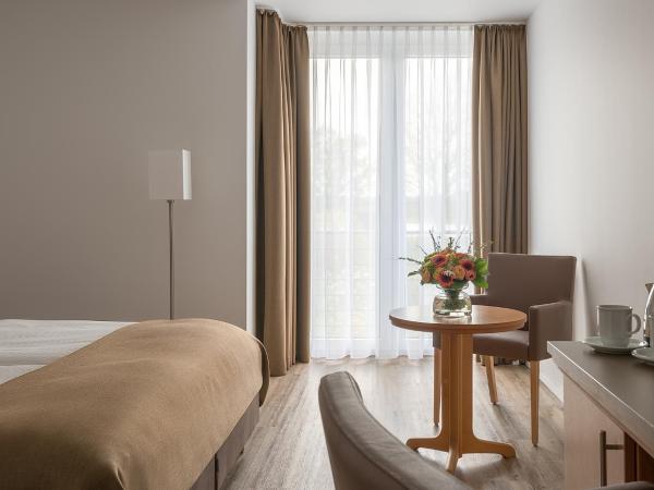 Hotel Chrisma : photo 1 de la chambre chambre double - vue sur jardin