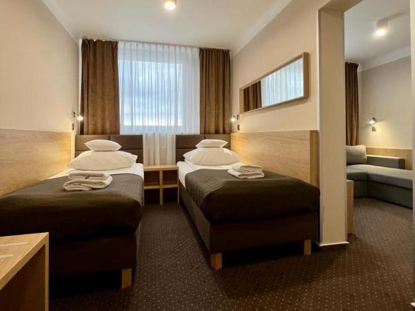 Hotel Boss : photo 1 de la chambre economy twin room with sofa bed