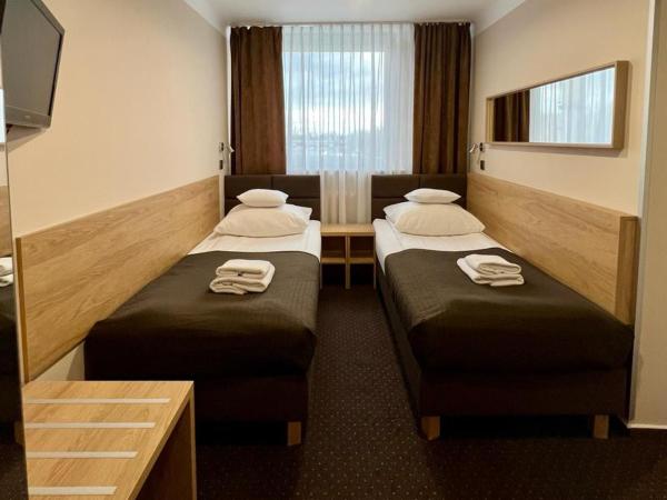 Hotel Boss : photo 2 de la chambre economy twin room with sofa bed