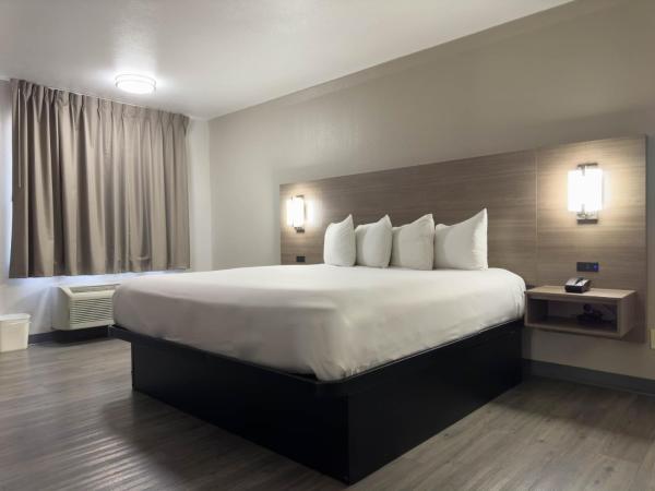 Americas Best Value Inn Austin : photo 2 de la chambre chambre lit king-size - non-fumeurs