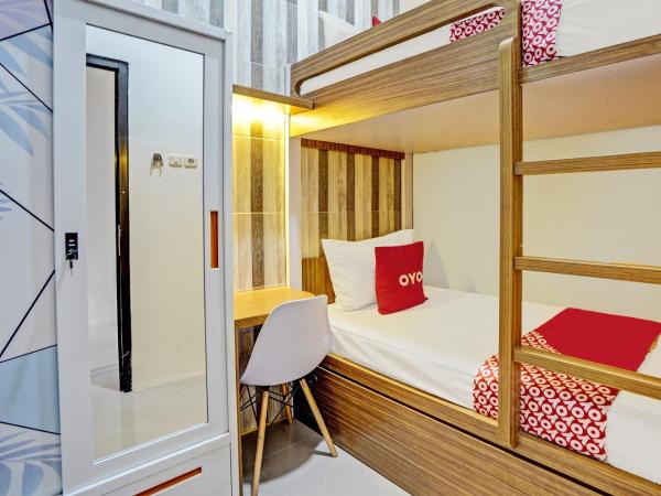 OYO 92435 Sunlo Cozy Home Family Homestay Syariah : photo 1 de la chambre chambre lits jumeaux Économique