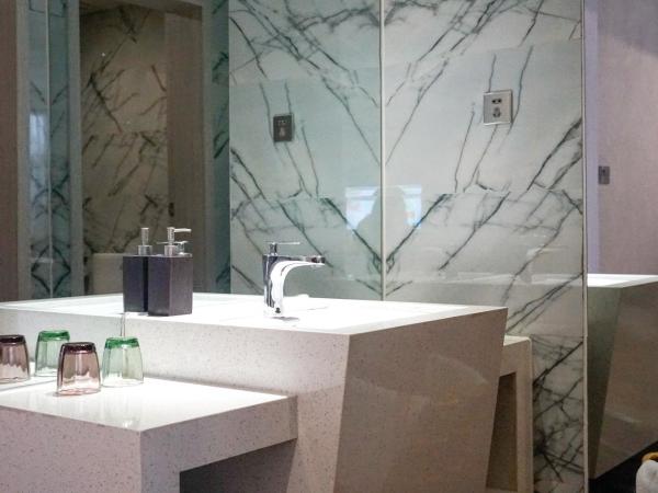 Paco Hotel Tianhe Coach Terminal Metro Guangzhou : photo 2 de la chambre chambre lit queen-size deluxe