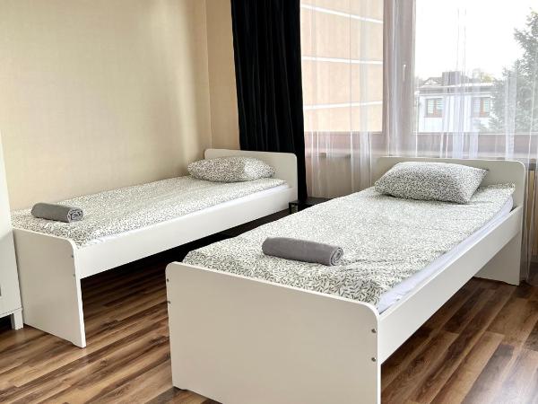 Pokoje Rezydencja Parysa : photo 5 de la chambre chambre quadruple avec salle de bains commune